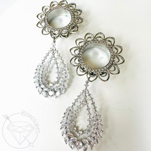 Load image into Gallery viewer, two ornate earrings with intricate designs and sparkling crystal elements.
