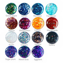 Load image into Gallery viewer, a collection of 16 circular nail polish bottles, each with a different color and glitter pattern. The bottles are arranged in a grid format, with four rows and four columns. Each bottle has a unique color and glitter design, creating a visually appealing and diverse collection.