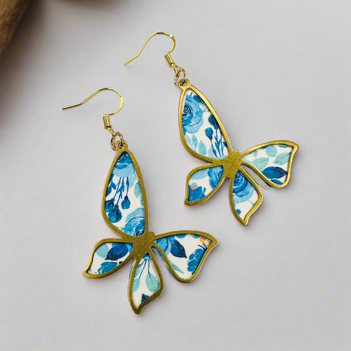 Blue butterfly gold frame dangle earrings