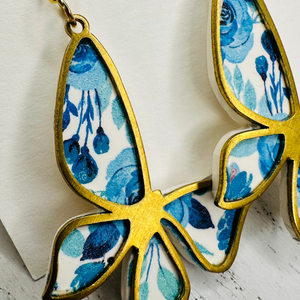 Blue butterfly gold frame dangle earrings