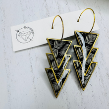 Load image into Gallery viewer, Black and gold leaf gold frame dangle earrings