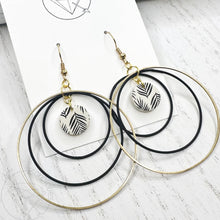 Load image into Gallery viewer, Black and gold leaf hoop dangle earrings