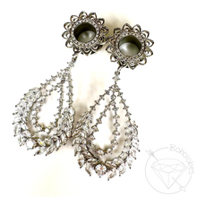 Load image into Gallery viewer, a pair of elegant earrings with intricate designs and sparkling gemstones.
